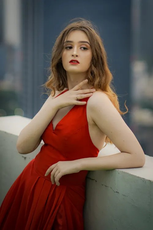 Woman in a scarlet halter-neck evening gown