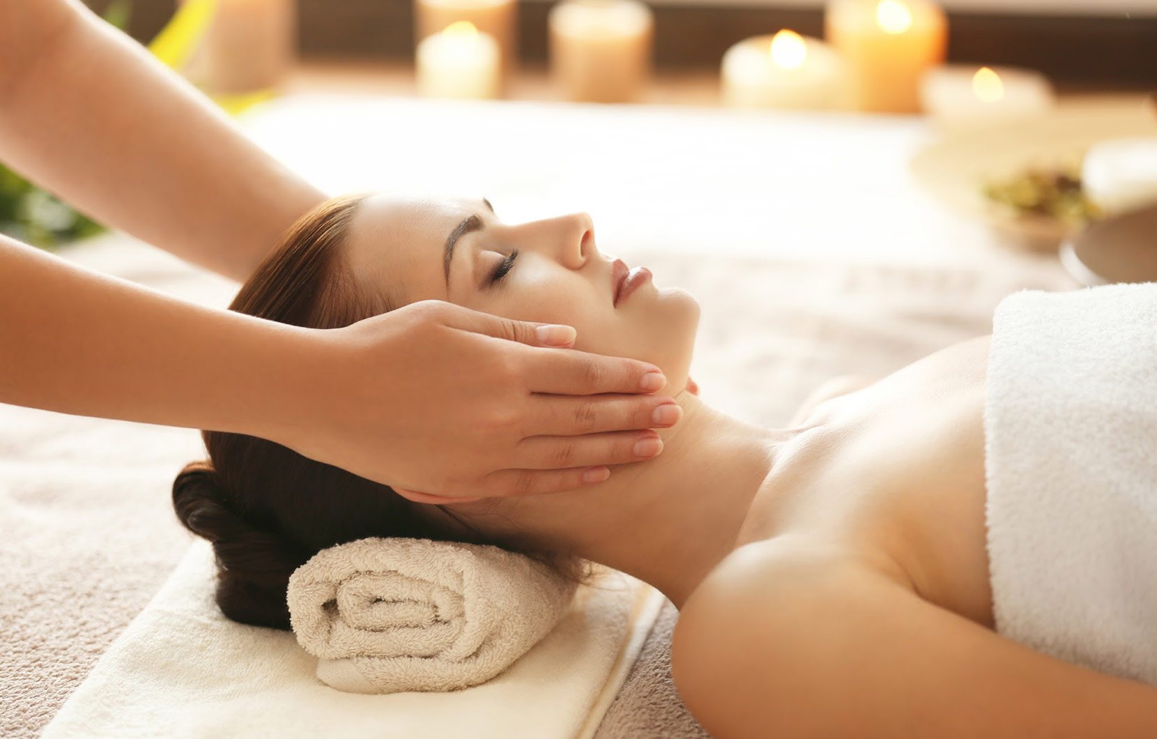 Client relaxing during a signature facial treatment