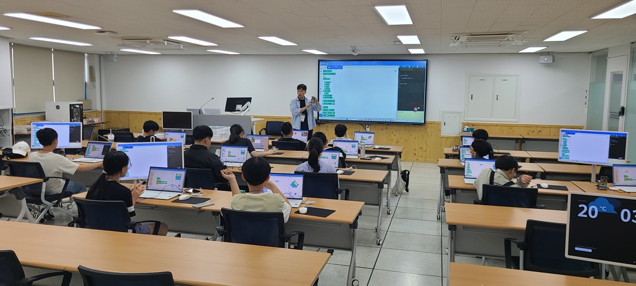 Students learning to code in the computer laboratory during a class